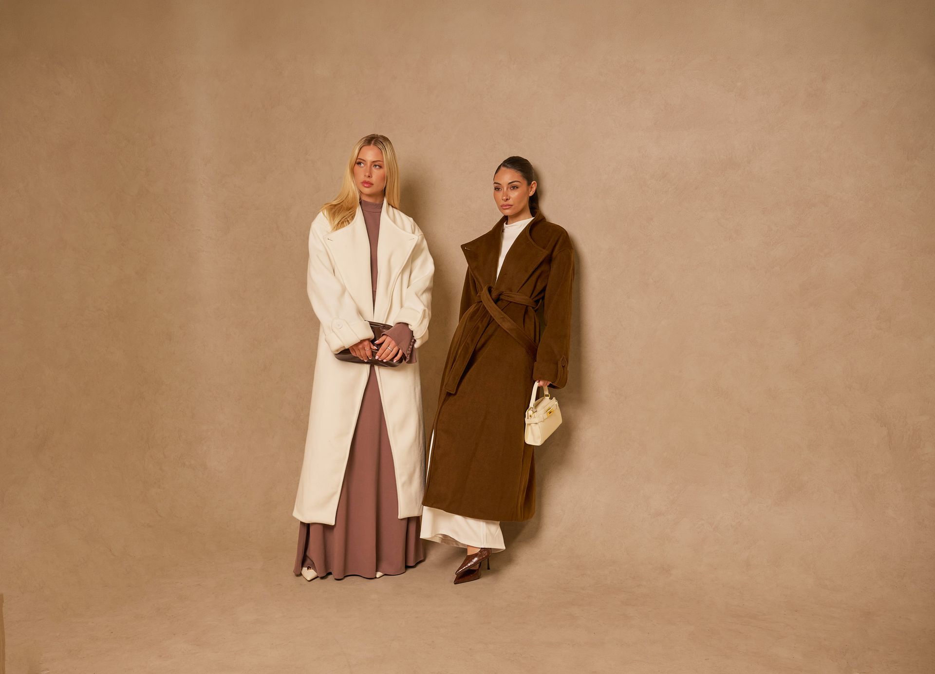Two models in tailored Modelle new-season outerwear